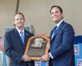 Jul 24, 2016; Cooperstown, NY, USA; Hall of Fame President Jeff Idelson presents Hall of Fame Inductee Mike Piazza with his Hall of Fame plaque during the 2016 MLB baseball hall of fame induction ceremony at Clark Sports Center. Mandatory Credit: Gregory J. Fisher-USA TODAY Sports