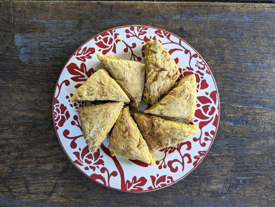 This photo shows a plate of pumpkin scones. Biscuits, pull-apart breads and sweet loaves are all trending as home bakers find the hobby satisfying on many levels. (Kim Cook via AP)