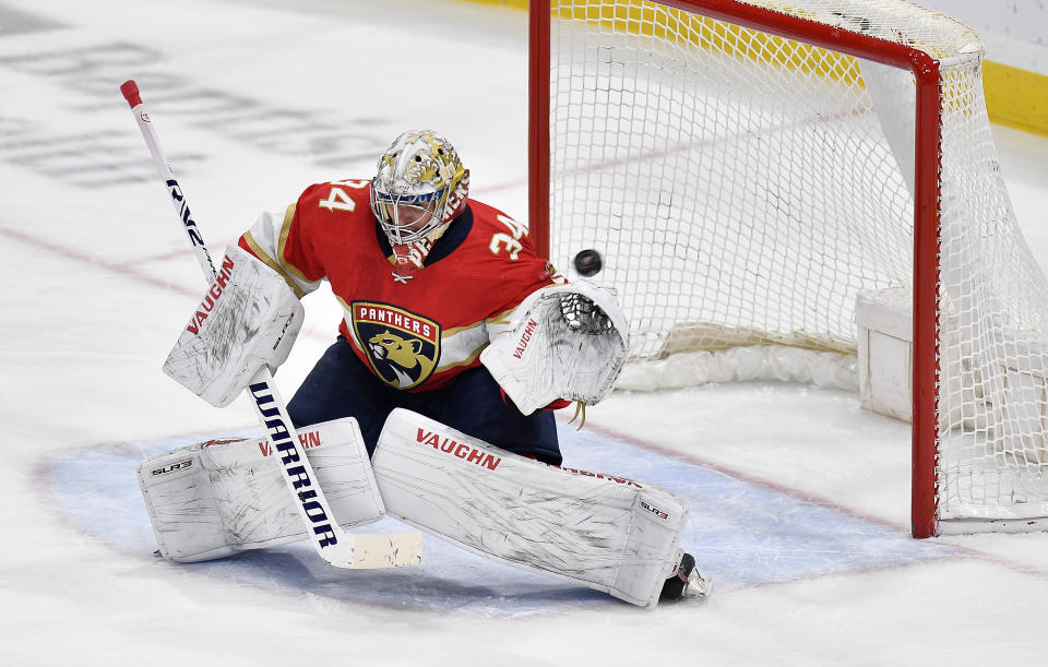 Florida Panthers goaltender Alex Lyon (34) deflects the puck during the first period of an NHL hockey game against the Buffalo Sabres, Tuesday, April 4, 2023, in Sunrise, Fla. (AP Photo/Michael Laughlin)