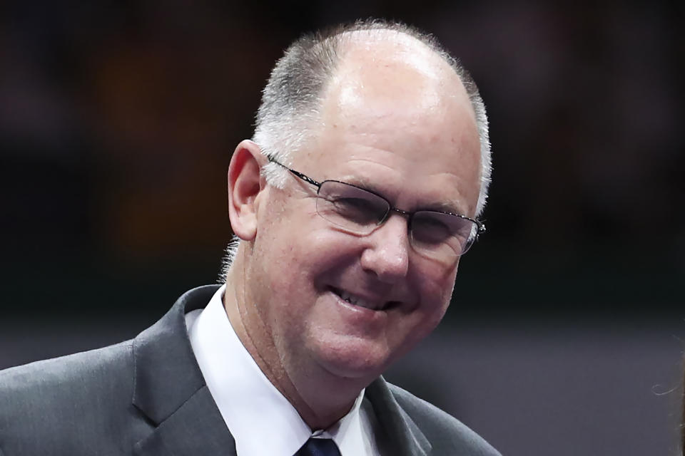 FILE - WTA Chief Executive Officer Steve Simon smiles during a retirement ceremony for Martina Hingis in Singapore on Oct. 29, 2017. An email purportedly from a Chinese professional tennis player that a Chinese state media outlet posted on Twitter has increased concerns about her safety as the sport's biggest stars and others abroad call for information about her well-being and whereabouts. Simon, the chairman and CEO of the Women's Tennis Association, questioned the authenticity of the email intended for him, in which Grand Slam doubles champion Peng Shuai says she is safe and that the assault allegation is untrue. (AP Photo/Yong Teck Lim, File)