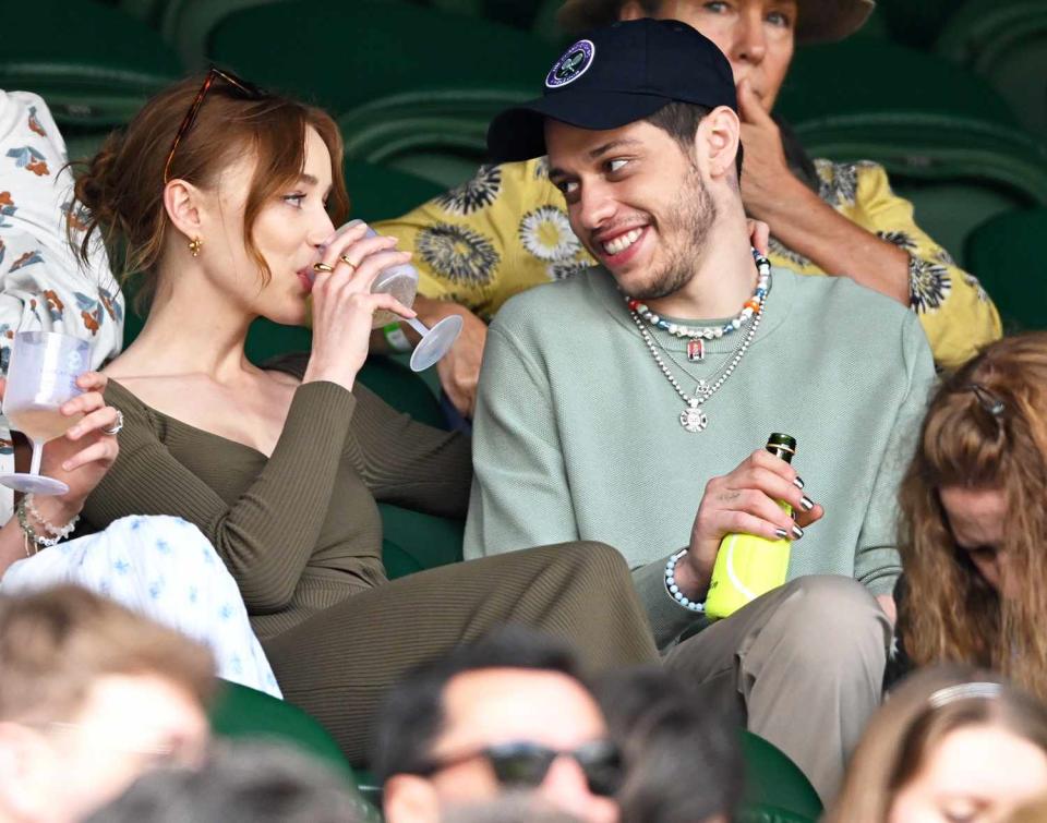 Phoebe Dynevor and Pete Davidson attend day 6 of the Wimbledon Tennis Championships at the All England Lawn Tennis and Croquet Club on July 03, 2021 in London, England.