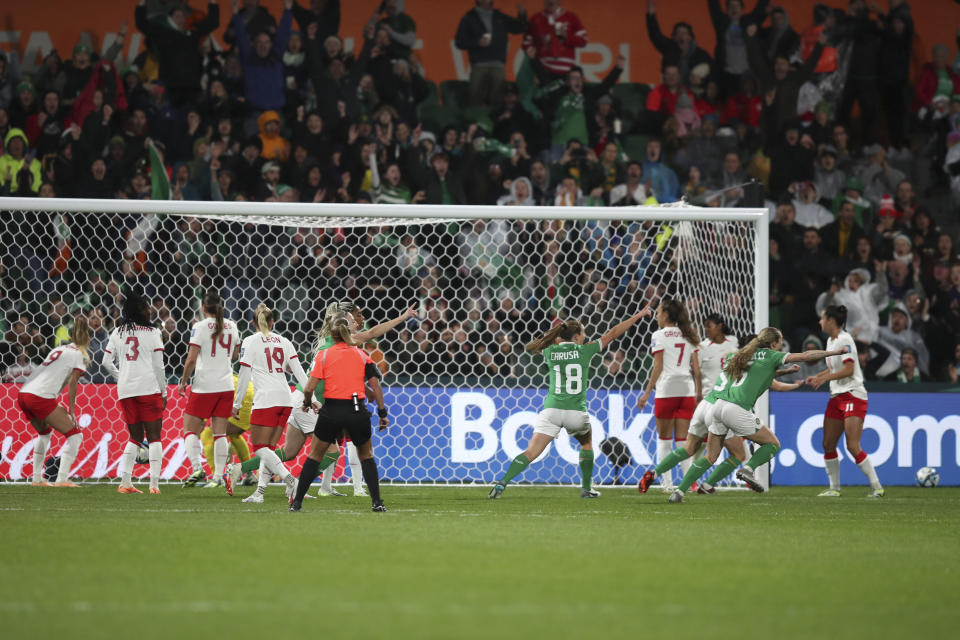 The ball goes straight into the net from a corner for the opening goal by Ireland's Katie McCabe during the Women's World Cup Group B soccer match between Canada and Ireland in Perth, Australia, Wednesday, July 26, 2023. (AP Photo/Gary Day)