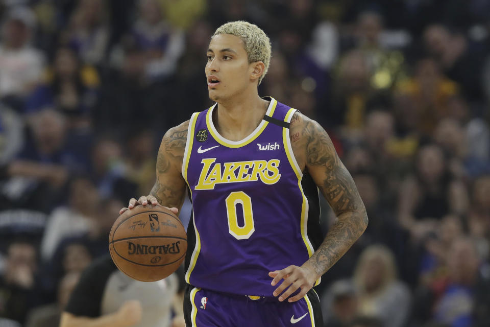 Los Angeles Lakers forward Kyle Kuzma (0) dribbles the ball up the court against the Golden State Warriors during the first half of an NBA basketball game in San Francisco, Thursday, Feb. 27, 2020. (AP Photo/Jeff Chiu)