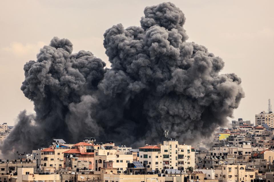 plumes of black smoke rise from Gaza city