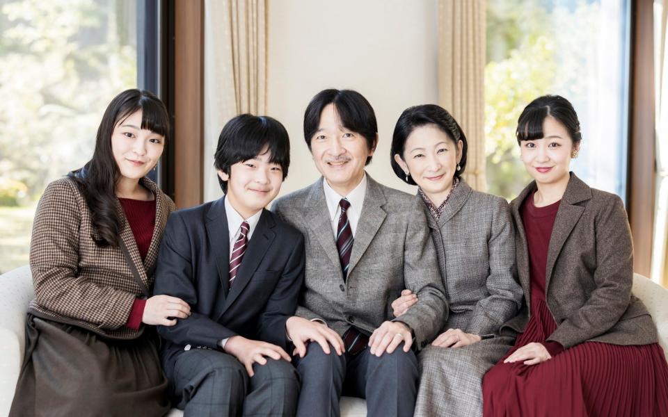 Japan's Crown Prince Akishino, cente, with his wife Crown Princess Kiko, second right, and their children, Princess Mako, left, Princess Kako and Prince Hisahito in November 2020 - Imperial Household Agency of Japan via AP