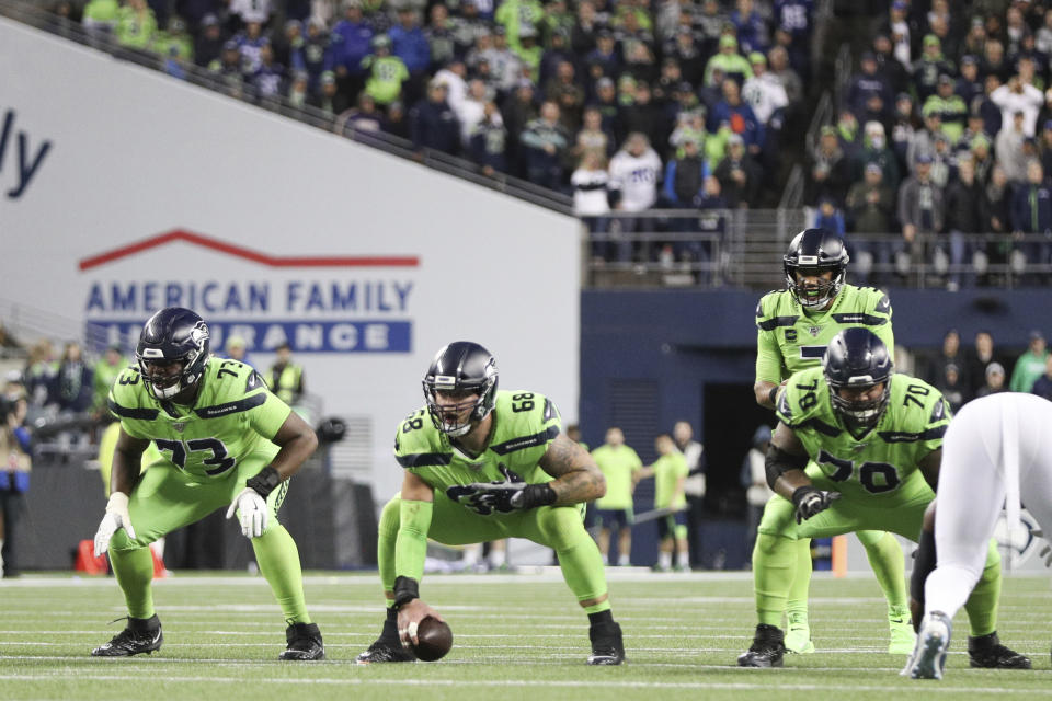 Seattle Seahawks offensive tackle Jamarco Jones (73), center Justin Britt (68) and offensive guard Mike Lupati (70) prepare for the snap to Seattle Seahawks quarterback Russell Wilson (3) during an NFL game against the Los Angeles Rams, Thursday, Oct. 3, 2019, in Seattle. The Seahawks defeated the Rams 30-29. (Margaret Bowles via AP)