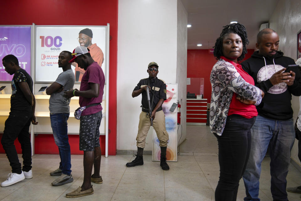 A private security officer guards a store in Cap-Haitien, Haiti, Wednesday, April 17, 2024. (AP Photo/Ramon Espinosa)