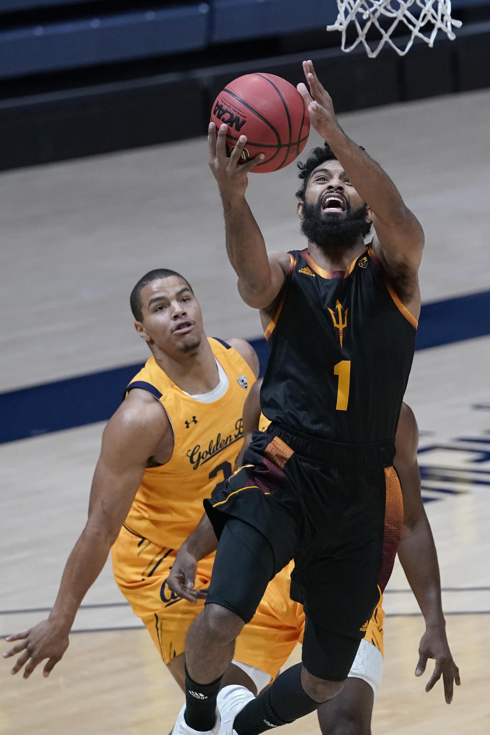 Arizona State guard Remy Martin (1) shoots in front of California's Matt Bradley during the first half of an NCAA college basketball game in Berkeley, Calif., Thursday, Dec. 3, 2020. (AP Photo/Jeff Chiu)