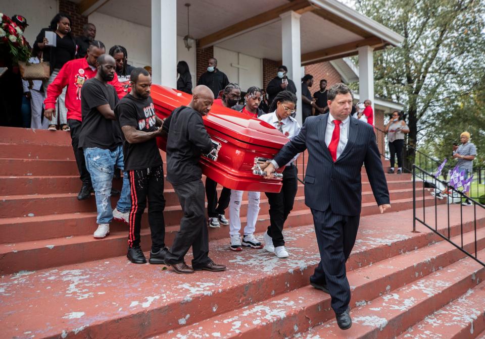 Funeral director Anthony Oxendine leads the body of Tyree Smith leaves King Solomon Baptist Church. Smith, age 16, was shot and killed while waiting for a bus to take him to school in downtown Louisville. Oct. 2, 2021