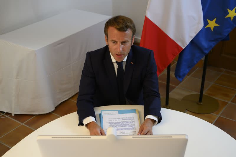 French President Emmanuel Macron speaks during a donor teleconference with other world leaders, in Bormes-les-Mimosas