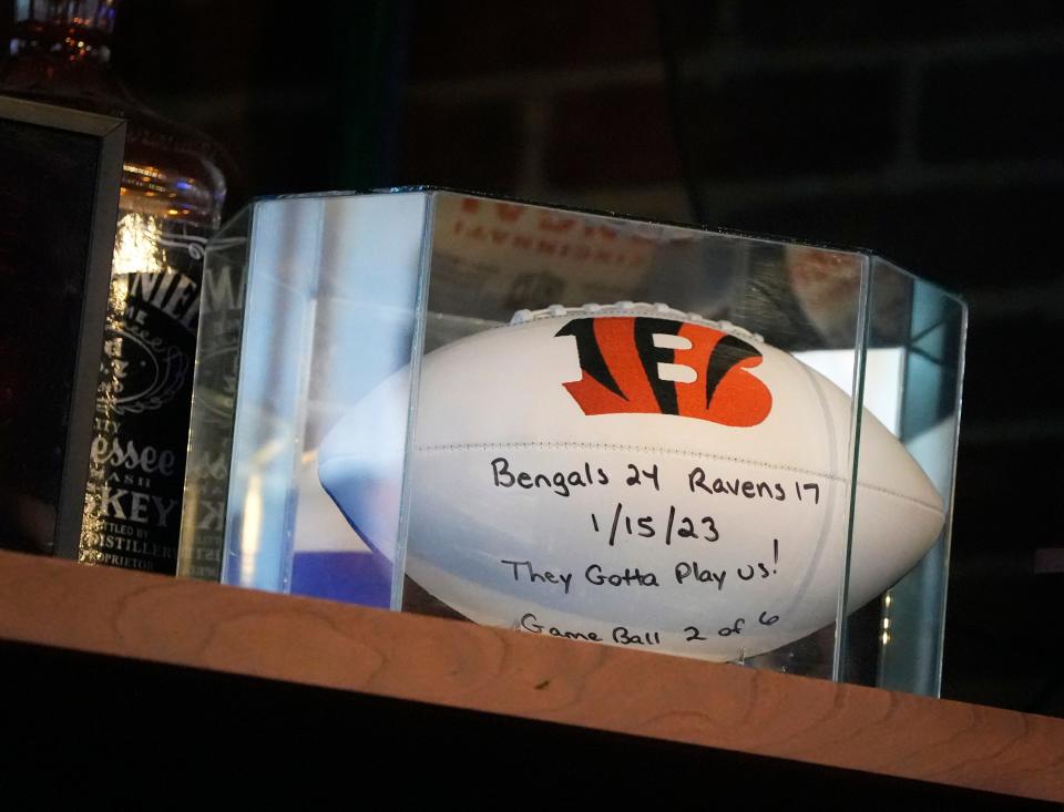 A Cincinnati Bengals game ball from a recent playoff win against the Baltimore Ravens is on display at Courtside Pizza in uptown Athens.