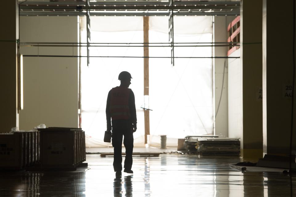 07 October 2019, Saxony, Dresden: A construction worker walks through a future production hall on the construction site of Bosch's new semiconductor factory and sees a silhouette. The semiconductor plant, which Bosch is currently building in the state capital for around one billion euros, is to become a showcase project in terms of digitization and automated production. Photo: Sebastian Kahnert/dpa-Zentralbild/dpa (Photo by Sebastian Kahnert/picture alliance via Getty Images)