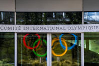The Olympic Rings are displayed at the entrance of the IOC, International Olympic Committee headquarters during the coronavirus disease (COVID-19) outbreak in Lausanne, Switzerland, Tuesday, March 24, 2020. (Jean-Christophe Bott/Keystone via AP)