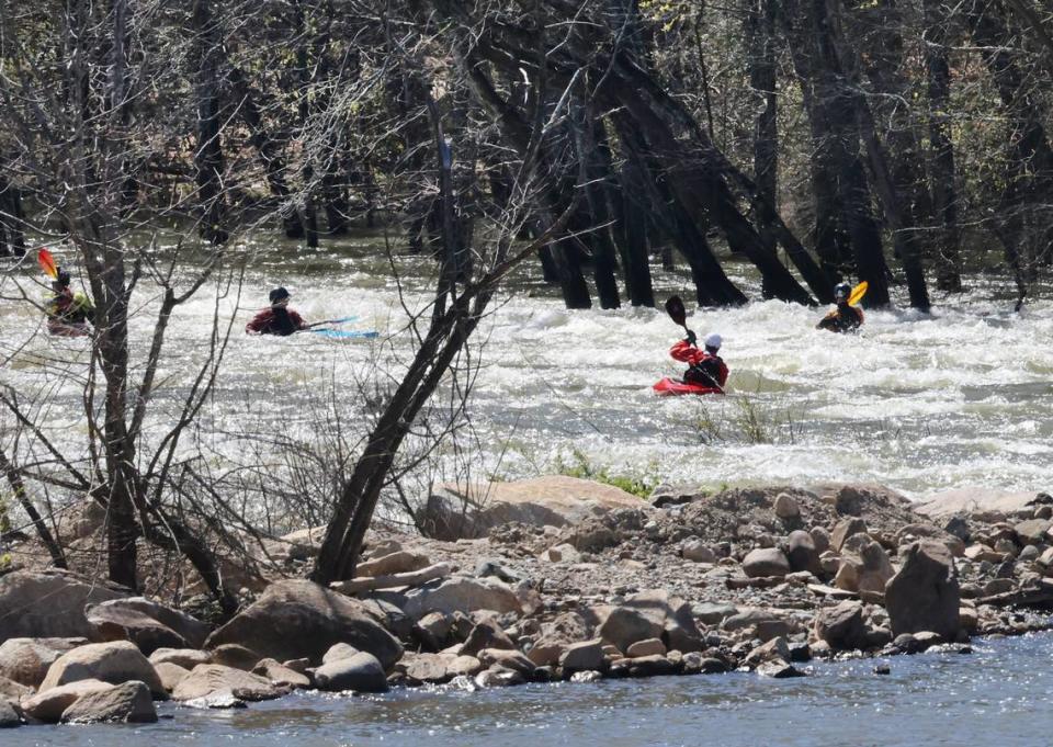 Kayakers enter the long bypass of the Catawba River in Great Falls, S.C. on Wednesday, March 15, 2023.