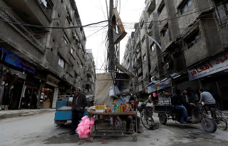 A man sells goods along a street in Ein Terma, a district of eastern Ghouta, Syria February 26, 2019. REUTERS/Omar Sanadiki