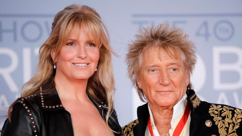 Rod Stewart (R) and his wife Penny Lancaster (L) pose on the red carpet on arrival for the BRIT Awards 2020 in London on February 18, 2020