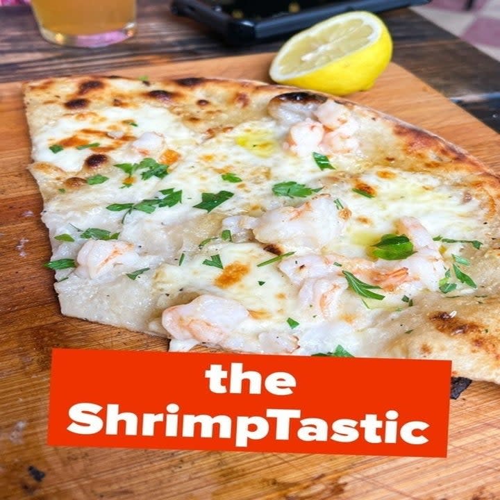 <div><p>Between <b>the White Buffalo</b> (loaded with the most tender chicken you've ever tasted, and plenty of creamy Gorgonzola), the seriously spicy <b>Sophia Loren</b> (that comes with a drizzle of spicy balsamic reduction that I literally dream about), and the shrimp scampi–turned–pizza <b>ShrimpTastic</b>, choosing just one is nearly possible. <b>So order multiples. You'll be glad you did.</b></p><p>Oh, and when "<b>Dad's Balls</b>" are on the menu — the owner's secret family meatball recipe that makes an appearance from time to time — get 'em. <b>Words alone can't describe just how delicious they are. They have to be tasted.</b></p></div><span> Ross Yoder</span>
