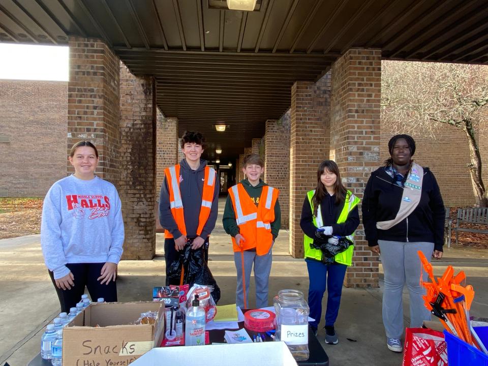 Girl Scout Troop 20094 members Ella Wolfe and Iteng Lohure host a cleanup event in partnership with Keep Knoxville Beautiful at Halls Middle School in December 2022.