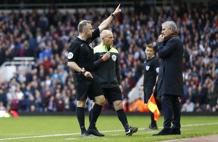 Football - West Ham United v Chelsea - Barclays Premier League - Upton Park - 24/10/15 Chelsea manager Jose Mourinho looks on as Referee Jonathan Moss send to the stands goalkeeping Christoph Lollichon and assistant first team coach Silvino Louro (not pictured) Reuters / Eddie Keogh Livepic