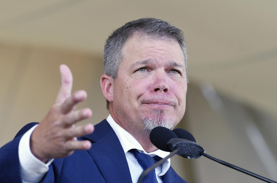 National Baseball Hall of Fame inductee Chipper Jones gestures while speaking during an induction ceremony at the Clark Sports Center on Sunday, July 29, 2018, in Cooperstown, N.Y. (AP Photo/Hans Pennink)