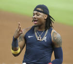 Atlanta Braves outfielder Ronald Acuna flashes three fingers after the Braves clinched their third consecutive NL East title with an 11-1 win over the Florida Marlins in a baseball game Tuesday, Sept. 22, 2020, in Atlanta. (Curtis Compton/Atlanta Journal-Constitution via AP)