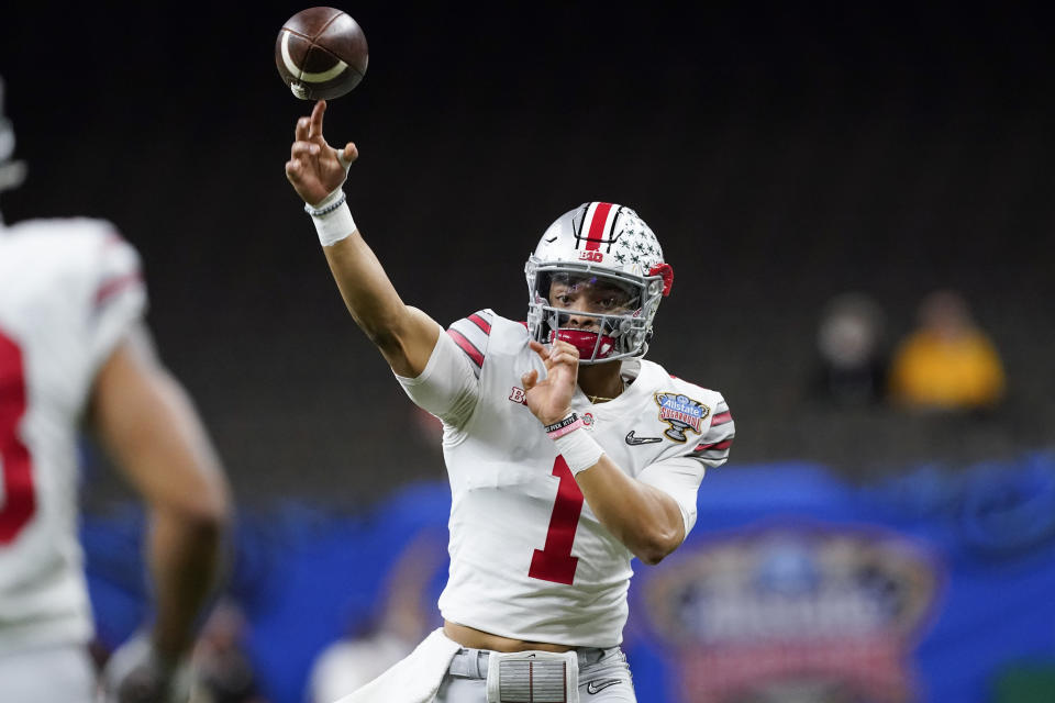 Ohio State quarterback Justin Fields passes against Clemson during the first half of the Sugar Bowl NCAA college football game Friday, Jan. 1, 2021, in New Orleans. (AP Photo/John Bazemore)