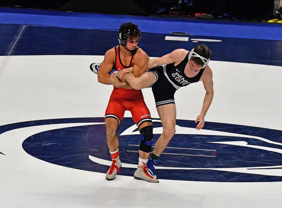 A bout at 141 pounds between Rutgers' four-time NCAA All-American and three-time NCAA top six finisher Sebastian Rivera (left) and defending 141-pound national champion Nick Lee of Penn State (right) will not take place Sunday night during the Rutgers-Penn State dual meet at Penn State's Rec Hall. because Lee protocols will keep him out of the lineup, according to Penn State' Wrestling's  twitter handle.