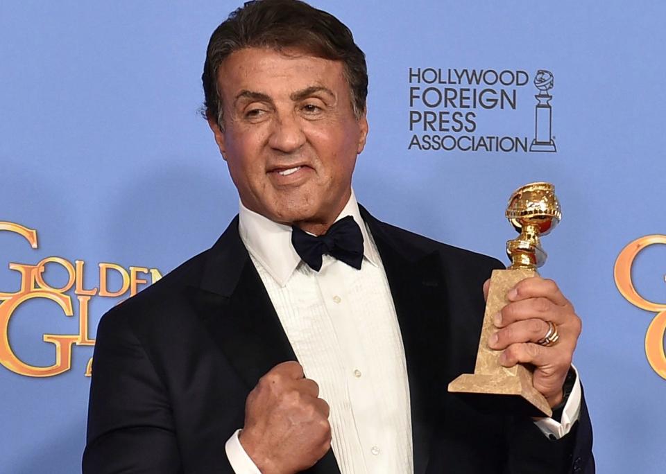Sylvester Stallone poses in the press room with the award for best performance by an actor in a supporting role in a motion picture for "Creed" at the 73rd annual Golden Globe Awards on Sunday, Jan. 10, 2016, at the Beverly Hilton Hotel in Beverly Hills, Calif. (Photo by Jordan Strauss/Invision/AP)