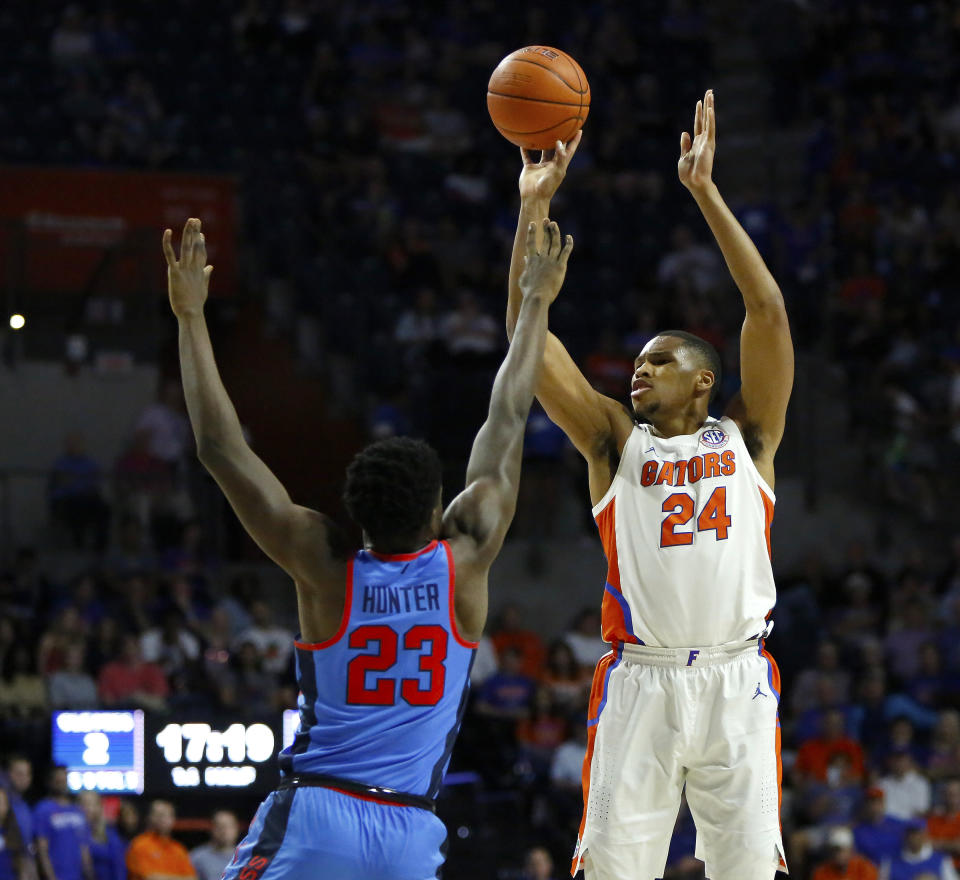 lorida center Kerry Blackshear (24) shoots a 3-pointer over Mississippi forward Sammy Hunter (23) during an NCAA college basketball game Tuesday, Jan. 14, 2020, in Gainesville, Fla. (Brad McClenny/The Gainesville Sun via AP)