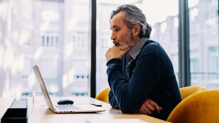 A man drafts his retirement letter. 