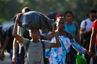 Migrants take part in a caravan heading to the U.S. border, near Tapachula