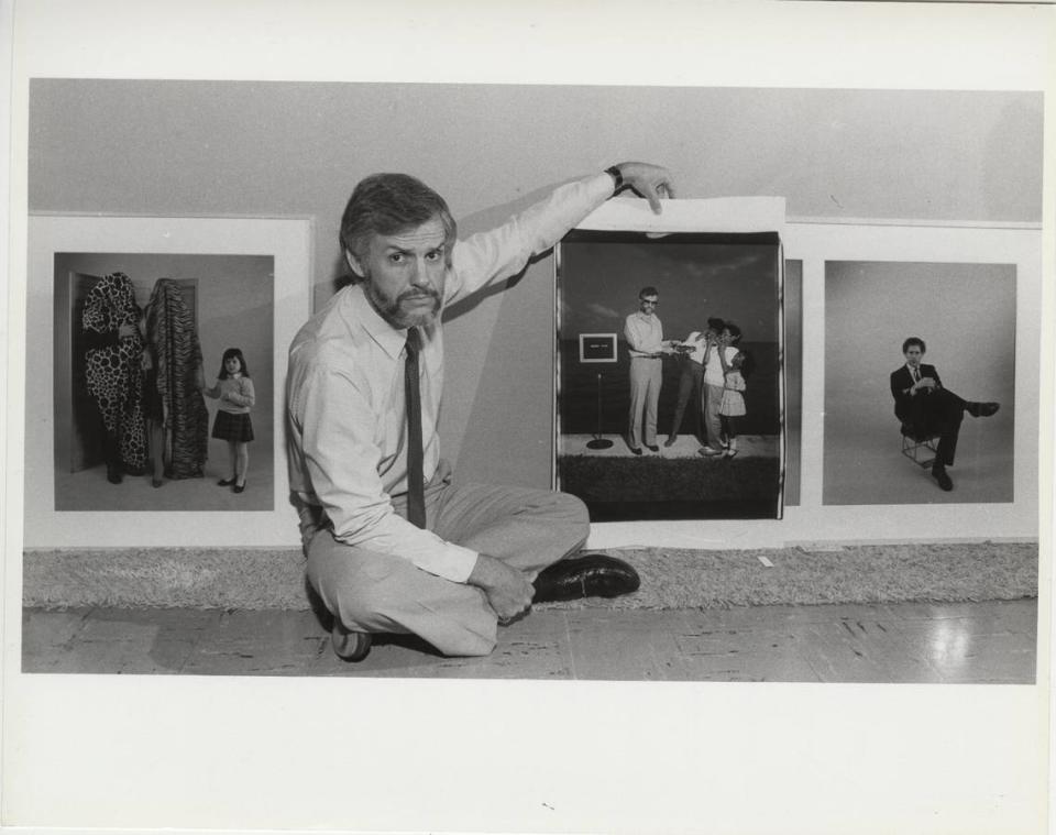 Fred Tasker with an oversize Polaroid that featured his image made by artist William Wegman. 