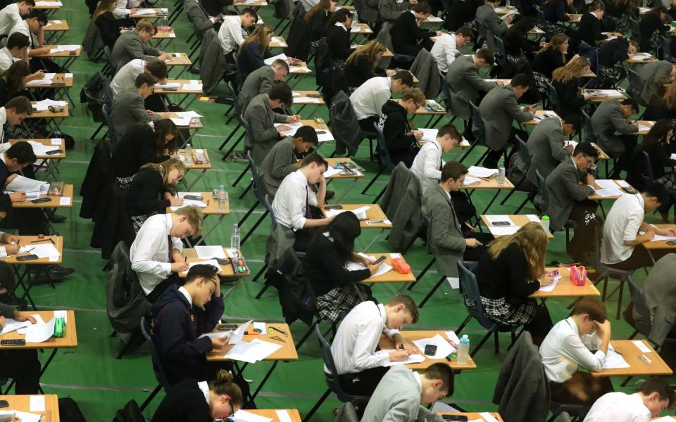 Students taking exam in a hall