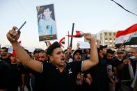 Iraqis march in Najaf on the anniversary of the anti-government protests