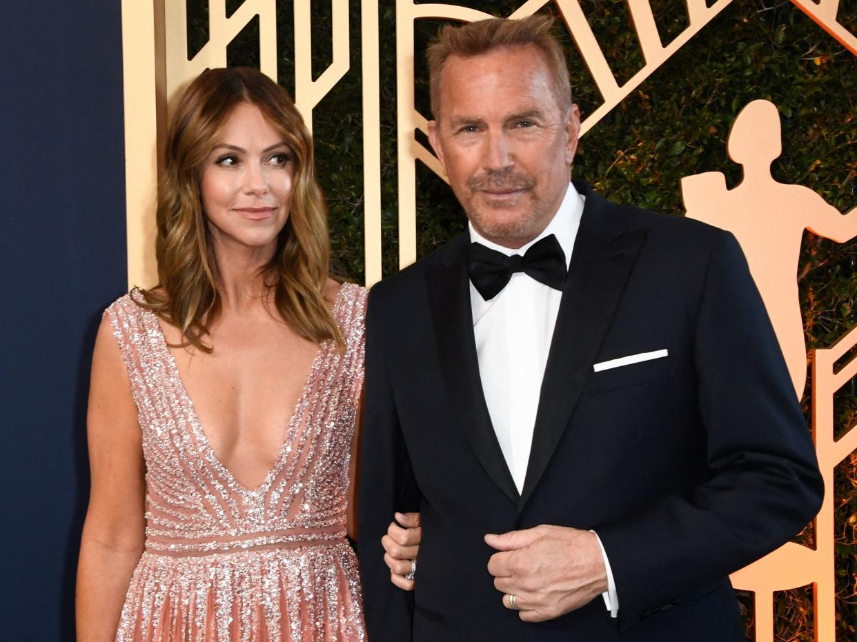 Kevin Costner and his wife Christine Baumgartner arrive for the 28th Annual Screen Actors Guild (SAG) Awards in 2022.