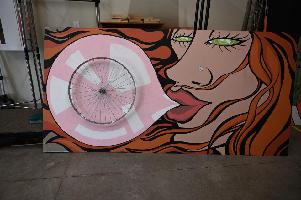 Created by Eric Rosario, this piece shows his wife blowing a bubble with a bike wheel. It was one of the first pieces made for Tama-Toledo's public art to be showcased on RAGBRAI.