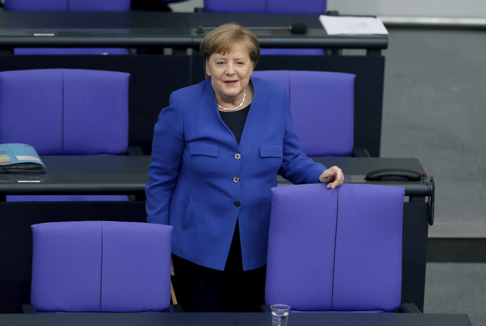German Chancellor Angela Merkel arrives for a meeting of the German federal parliament, Bundestag, at the Reichstag building in Berlin, Germany, Wednesday, May 13, 2020. (AP Photo/Michael Sohn)