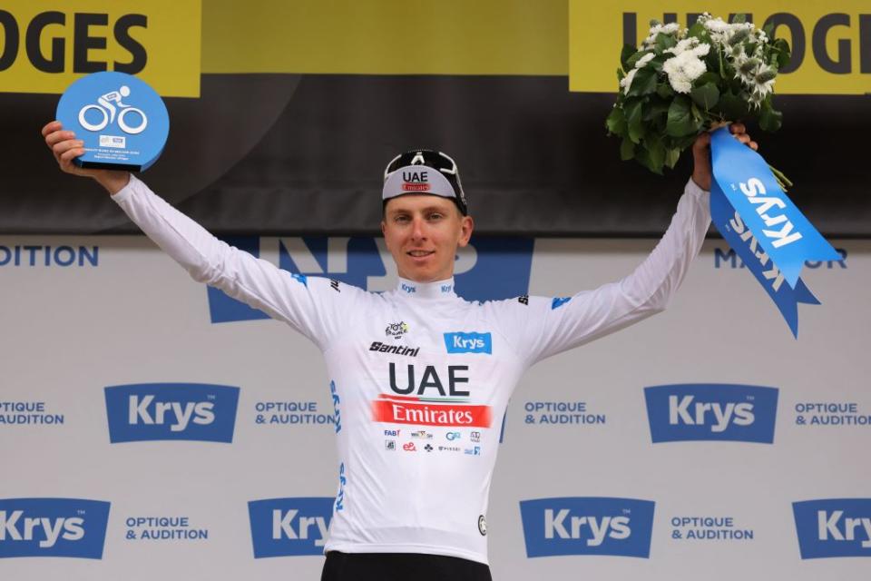 UAE Team Emirates Slovenian rider Tadej Pogacar celebrates on the podium with the best young riders white jersey after the 8th stage of the 110th edition of the Tour de France cycling race 201 km between Libourne and Limoges in central western France on July 8 2023 Photo by Thomas SAMSON  AFP Photo by THOMAS SAMSONAFP via Getty Images