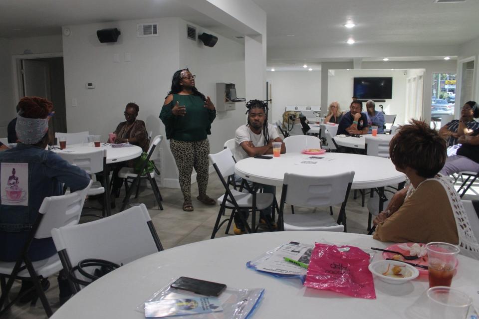 Chanae Jackson, standing in center, speaks during The Power of the Ballot Lunch and Learn luncheon Wednesday in NW Gainesville.
(Credit: Photo by Voleer Thomas, Correspondent)