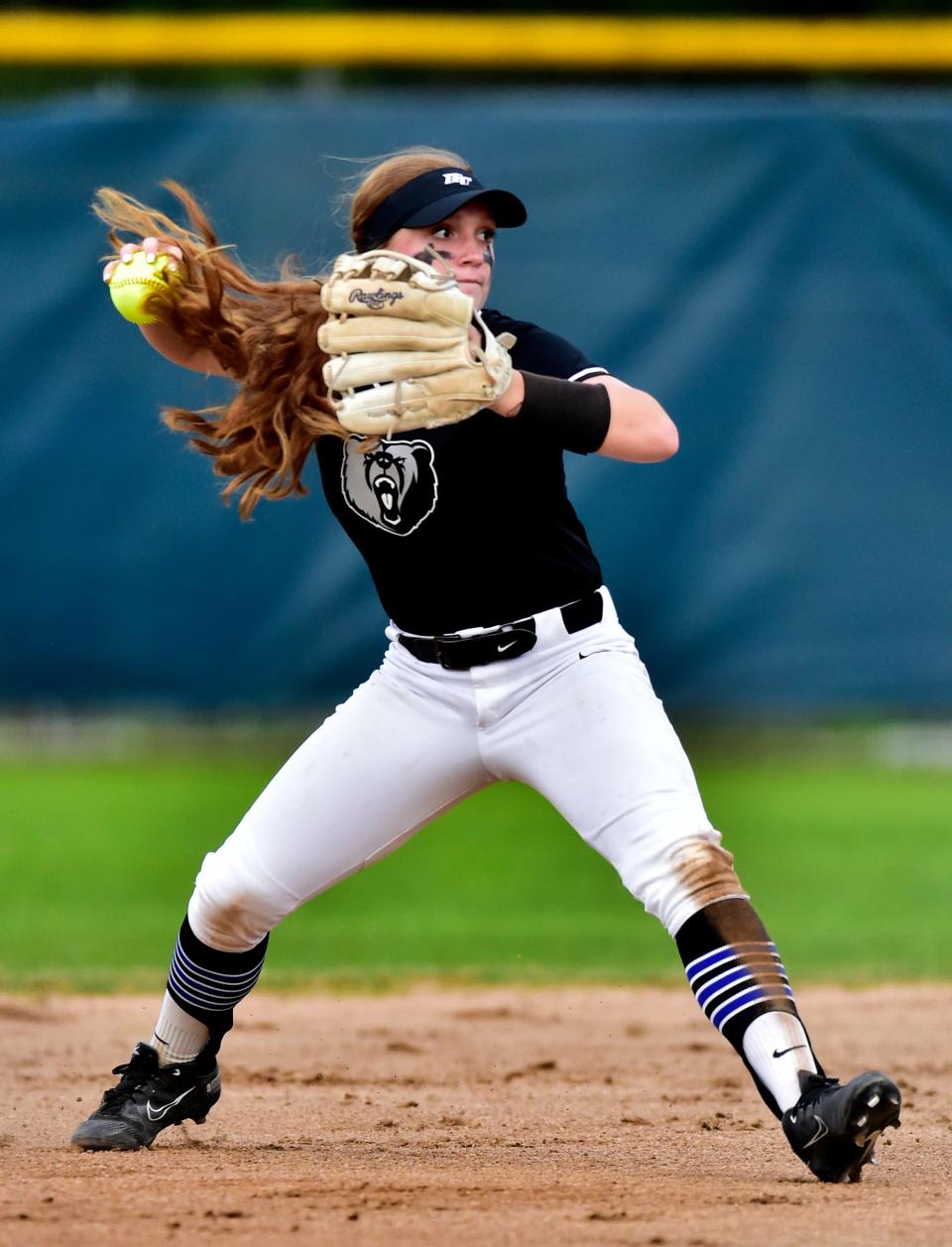 Bartram Trail's Lucie McDonald throws to first during a March softball game against Ponte Vedra.