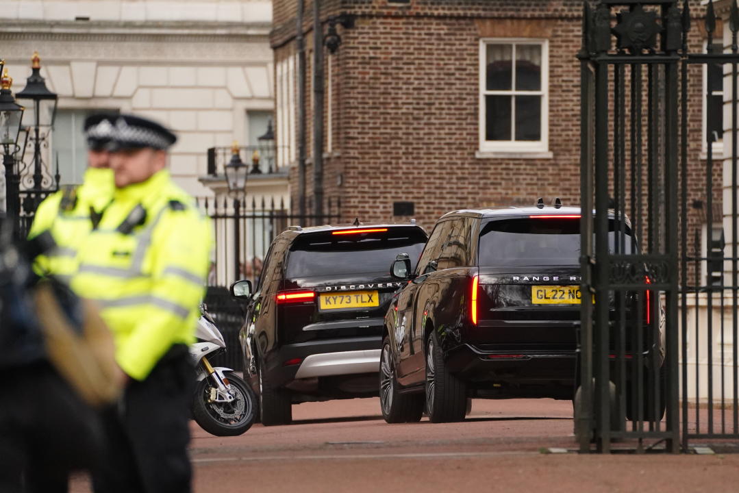 Two black SUVs, believed to be carrying Prince Harry, arrive at Clarence House, London, following the announcement of King Charles III's cancer diagnosis on Monday evening. The King has been diagnosed with a form of cancer and has begun a schedule of regular treatments, and while he has postponed public duties he 