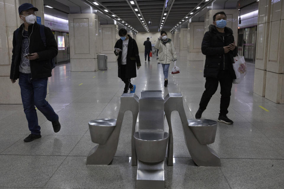 Residents walk through a subway station in Wuhan in central China's Wuhan province on Wednesday, April 1, 2020. Skepticism about China’s reported coronavirus cases and deaths has swirled throughout the crisis, fueled by official efforts to quash bad news in the early days and a general distrust of the government. In any country, getting a complete picture of the infections amid the fog of war is virtually impossible. (AP Photo/Ng Han Guan)