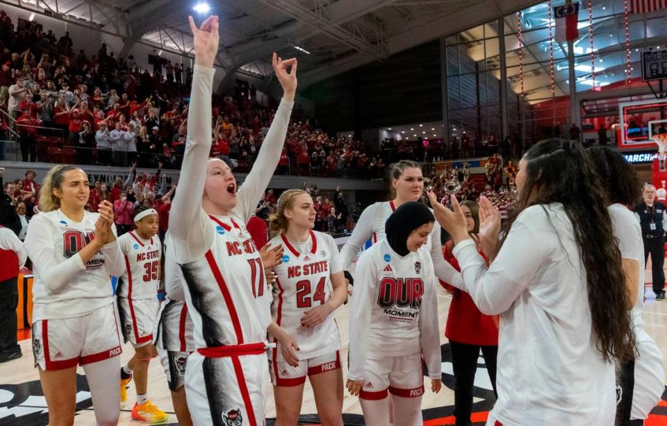 NC State’s freshman Maddie Cox (11) celebrates with teammates after the Wolpack’s 79-72 win against Tennessee during the second round of the Division I Women’s Basketball Championship at Reynolds Coliseum in Raleigh, on March 25, 2024. The Wolfpack won 79-72.