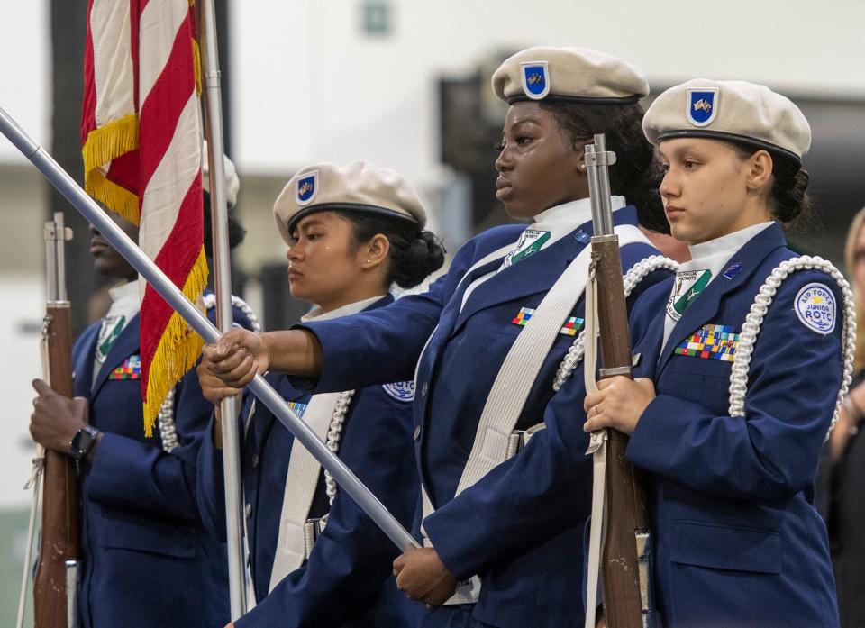 The Burncoat High School JROTC cadets present the colors at the start of graduation on Monday.