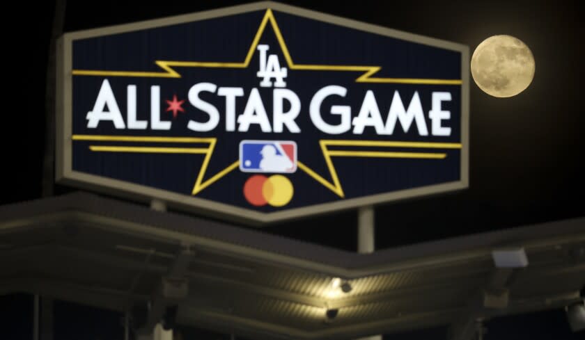 Los Angeles, CA - October 21: The moon rises behind the Los Angeles Dodgers All Star Game sign during the sixth inning in game five in the 2021 National League Championship Series against the Atlanta Braves at Dodger Stadium on Thursday, Oct. 21, 2021 in Los Angeles, CA. (Robert Gauthier / Los Angeles Times)