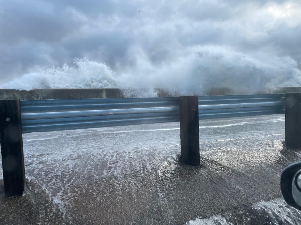 Splashover amid a rain storm at Hampton Beach brings water onto Ocean Boulevard Wednesday, Jan. 10, 2024.