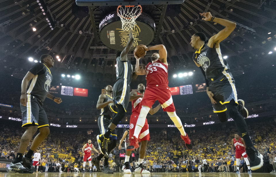 Toronto Raptors centre Marc Gasol #33 battles Golden State Warriors forward Draymond Green #23 for a rebound during first half basketball action in Game 4 of the NBA Finals in Oakland, California on Friday, June 7, 2019. (Photo by The Canadian Press/Frank Gunn)