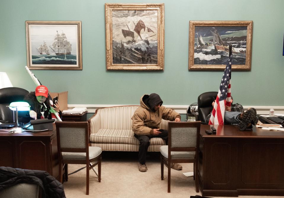Rioters inside Nancy Pelosi's office at the Capitol, January 6, 2021.