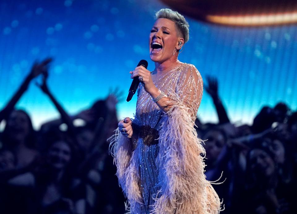 Pink performs "Hopelessly Devoted To You" during a tribute to the late singer Olivia Newton-John at the American Music Awards on Sunday, Nov. 20, 2022, at the Microsoft Theater in Los Angeles. (AP Photo/Chris Pizzello) ORG XMIT: CADA894