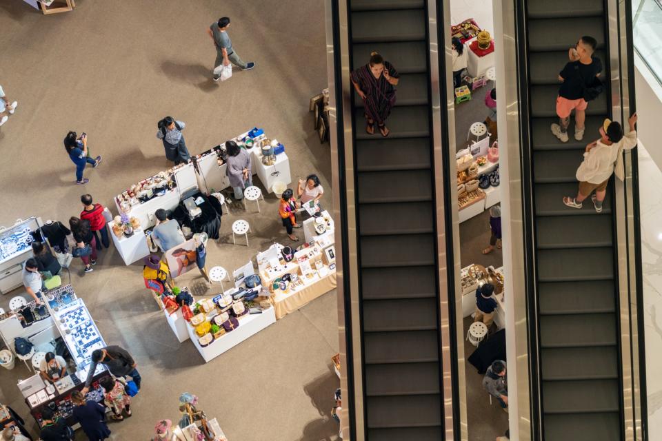 Shoppers ride escalators at the Iconsiam mega mall, jointly developed by Siam Piwat Group, Magnolia Quality Development Corp. (MQDC) and Charoen Pokphand Group, in Bangkok, Thailand, Friday, August 16, 2019. 